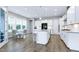 Bright kitchen with stainless appliances, center island, and a breakfast nook at 213 W Weatherford Dr, Angier, NC 27501
