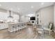 Open-concept kitchen with an island, dining area, and a view of the living room at 213 W Weatherford Dr, Angier, NC 27501