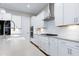 Modern kitchen with island, farm sink, stainless appliances and white cabinets at 213 W Weatherford Dr, Angier, NC 27501