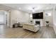 Spacious living room with fireplace, recessed lighting, and modern furnishings at 213 W Weatherford Dr, Angier, NC 27501