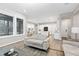 Open-concept living area with hardwood floors and seamless flow to the kitchen at 213 W Weatherford Dr, Angier, NC 27501