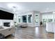Bright living room featuring hardwood floors, fireplace, and comfortable seating at 213 W Weatherford Dr, Angier, NC 27501