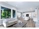 Open living space with large windows, hardwood floors and modern decor at 213 W Weatherford Dr, Angier, NC 27501