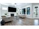 Comfortable living room with hardwood floors, fireplace, and ample natural light at 213 W Weatherford Dr, Angier, NC 27501