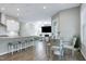 Open-concept space with a fireplace, kitchen, and dining area at 213 W Weatherford Dr, Angier, NC 27501
