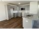 Modern kitchen featuring gray cabinets, granite countertops and stainless steel appliances at 223 Magnolia Run Way, Benson, NC 27504