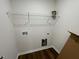 A practical laundry room with shelving and hookups, ready for appliances at 223 Magnolia Run Way, Benson, NC 27504