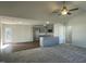 Bright and airy living room with a breakfast bar and open to a large window and back patio at 223 Magnolia Run Way, Benson, NC 27504