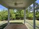 Screened-in back porch with ceiling fan and beautiful views of the lush, green backyard at 235 Meadowbark Bnd # 26, Garner, NC 27529