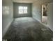 Unfinished bedroom featuring a bright window and an adjacent room at 235 Meadowbark Bnd # 26, Garner, NC 27529