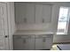 Kitchenette featuring elegant gray cabinets, quartz countertops, and a stylish backsplash at 235 Meadowbark Bnd # 26, Garner, NC 27529