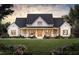 Stunning home exterior featuring a large front yard, covered porch, and a charming combination of stone and siding at 2600 Banks Rd # 1, Raleigh, NC 27603