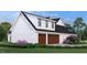 Charming exterior with a two-car garage, contrasting trim, and well-maintained landscaping creating a modern look at 2600 Banks Rd # 1, Raleigh, NC 27603