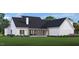 Lovely home exterior with a covered patio, neat landscaping, and sleek window designs for a perfect blend of indoor-outdoor living at 2600 Banks Rd # 1, Raleigh, NC 27603