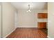 Bright dining area with modern lighting fixtures and laminate wood flooring at 3009 Winston Dr # 90, Burlington, NC 27215
