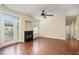 Open living room with fireplace and neutral tones, illuminated by natural light at 3009 Winston Dr # 90, Burlington, NC 27215