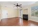 Bright living room features a cozy fireplace, ceiling fan, and access to the outdoors at 3009 Winston Dr # 90, Burlington, NC 27215