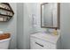 Stylish half-bath with modern fixtures, elegant mirror, and sleek vanity at 312 Bickett Blvd, Raleigh, NC 27608