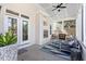 An inviting screened porch with comfortable seating, a fireplace, and a ceiling fan at 312 Bickett Blvd, Raleigh, NC 27608