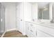 Modern bathroom with a double vanity, sleek white cabinetry, and a glass-enclosed shower at 341 Church St # 67, Wendell, NC 27591
