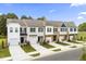 Beautiful new townhomes boast varied exterior colors, front-entry garages, and well-kept landscaping at 341 Church St # 67, Wendell, NC 27591