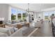 Open-concept living room showcases comfortable seating, modern decor, and an adjoining kitchen at 341 Church St # 67, Wendell, NC 27591