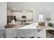 Modern kitchen with a stainless steel appliances, quartz countertops, and white cabinetry at 3701 Massey Pond Trl, Raleigh, NC 27616