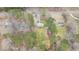 Overhead view of a landscaped property featuring lush greenery and a well-maintained home nestled within the trees at 4082 Old Franklinton Rd, Franklinton, NC 27525