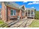 Brick home backyard featuring a patio with an outdoor kitchen, grill and scenic views at 4270 Aviemore Run, Burlington, NC 27215
