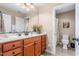 Bathroom vanity with cabinet storage, stone countertops, and a large framed mirror at 4270 Aviemore Run, Burlington, NC 27215
