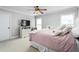 Bedroom features a ceiling fan, plush bedding, and neutral-toned walls for a relaxing ambiance at 4270 Aviemore Run, Burlington, NC 27215