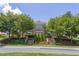 Stunning stone home featuring an elegant facade, landscaped entrance, and well-maintained greenery at 4270 Aviemore Run, Burlington, NC 27215