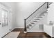 Bright foyer with an elegant staircase and gleaming wood floors creates a welcoming entrance to the home at 4270 Aviemore Run, Burlington, NC 27215