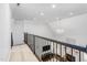 Interior home view highlighting the second story landing and a view of the living room below at 4270 Aviemore Run, Burlington, NC 27215
