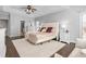 Bedroom features ceiling fan, sitting area, dresser, bedside tables and hardwood floors at 4270 Aviemore Run, Burlington, NC 27215