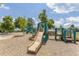 Community playground featuring slides, climbing structures, and a soft, padded ground at 4270 Aviemore Run, Burlington, NC 27215