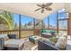 Inviting screened porch with comfortable seating and a ceiling fan, perfect for outdoor relaxation at 4270 Aviemore Run, Burlington, NC 27215