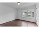 Bright bedroom featuring hardwood floors, a large window, and neutral paint, creating a serene atmosphere at 5 Bart St, Raleigh, NC 27610