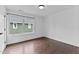 Bright bedroom featuring hardwood floors, fresh white paint, and a large window at 5 Bart St, Raleigh, NC 27610