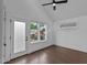 Bright bedroom with hardwood floors, ceiling fan, and large windows with backyard views at 5 Bart St, Raleigh, NC 27610
