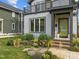 Inviting entrance features a bright, colorful door and lush landscaping at 5 Bart St, Raleigh, NC 27610