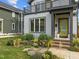 Close up of the house showcasing the landscaped front yard and a peek at the second story balcony at 5 Bart St, Raleigh, NC 27610