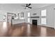 Open-concept layout with hardwood floors, a kitchen, a fireplace, and a view of the backyard at 5 Bart St, Raleigh, NC 27610
