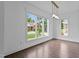 Bright living room featuring large windows and hardwood floors, offering a welcoming and airy atmosphere at 5 Bart St, Raleigh, NC 27610
