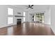Open living room featuring a fireplace, plenty of natural light, and hardwood floors at 5 Bart St, Raleigh, NC 27610