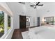 Airy bedroom with high ceilings, barn door to the ensuite, and large windows, offering style and comfort at 5 Bart St, Raleigh, NC 27610