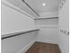 Walk-in closet featuring multiple shelves and rods, providing ample storage space at 5 Bart St, Raleigh, NC 27610