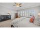 Bright main bedroom showcasing a dresser, seating, and an abundance of natural light at 516 Ivy Arbor Way, Holly Springs, NC 27540