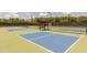 Modern pickleball courts featuring benches and shaded areas for players at 516 Ivy Arbor Way, Holly Springs, NC 27540