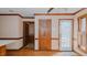 Breakfast nook area featuring hardwood floors, wood trim and a back door at 5405 Friendship Patterson Mill Rd, Burlington, NC 27215